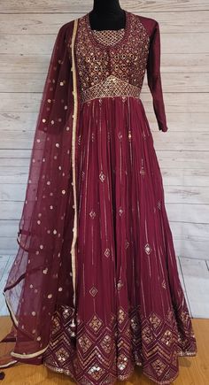 Beautiful Maroon floor length anarkali dress fully embroidered in georgette fabric,comes with matching net dupatta & strechable leggings. Festive Floor-length Anarkali Set With Sheer Dupatta, Floor-length Chinon Salwar Kameez With Cutdana, Traditional Maxi Length Churidar With Sheer Dupatta, Navratri Georgette Anarkali Set, Navratri Anarkali Set In Georgette, Festive Anarkali Set With Mirror Work, Maxi Length, Festive Anarkali Churidar In Georgette, Festive Maxi-length Anarkali Set With Mirror Work, Anarkali Georgette Churidar For Diwali