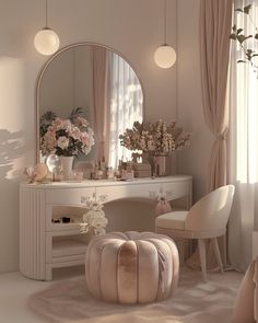 a bedroom with a vanity, mirror and flowers in vases on the table next to it