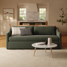 a living room filled with furniture and a white rug