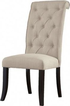 an upholstered dining chair with buttons on the back and legs, in beige fabric