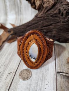 Check out this item in my Etsy shop https://www.etsy.com/listing/1390418259/dendrite-opal-tooled-leather-cuffstone Rustic Hand Tooled Leather Jewelry, Western Style Brown Cuff Bracelet As Gift, Rustic Leather Stamped Jewelry, Southwestern Hand-tooled Brown Bracelets, Southwestern Hand Tooled Brown Cuff Bracelet, Handmade Western Style Brown Cuff Bracelet, Handmade Western Brown Cuff Bracelet, Western Hand Tooled Cuff Bracelet As Gift, Artisan Stamped Brown Jewelry