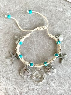 Adorn your leg with a gorgeous shell anklet! This macrame ankle bracelet with blue beads that resemble the ocean features silver starfish, shells and a wave charm.  *comes ready for gift giving in a jewelry pouch Bohemian Strand Anklet With Starfish Charm, Turquoise Beach Anklets With Starfish Charm, Turquoise Anklets With Starfish Charm For Beach, Blue Starfish Charm Anklet For Vacation, Beach Silver Macrame Jewelry, Blue Anklet With Starfish Charm For Vacation, Bohemian Beaded Bracelets With Starfish Charm For Beach, Bohemian Beaded Bracelet With Starfish Charm For Vacation, Bohemian Strand Beaded Bracelet With Starfish Charm