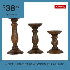 three wooden candlesticks are on sale for $ 38 99