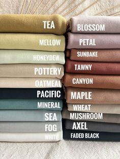 a stack of folded towels with the words tea, mellow, honeydew, potty, tawny, oatmeal, pacific, mushroom, sea, and fox