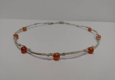 "DETAILS -Gemstone- Carnelian -Bead size- 6mm -Bead shape- round -Material- hemp -Length- 15\" If you need a different length feel free to message me:) *With all of my designs I strive for high quality and pay close attention to detail. *Great for casual occasions or going out, also great for a gift for your wife, sister, best friend, etc *Be kind to your hemp jewelry! Care instructions to ensure a longer lasting piece! - Remove your jewelry before sleeping.  - Do not bathe or swim while wearing, water will weaken the fibers and reduce durability. - Perfumes, essential oils, lotion and cleaning products will break down the hemp faster.  - Store in a cool dry place out of direct sunlight. *Feel free to contact me with any questions! If you are unhappy with the product, send it back and I wi Earthy Adjustable Round Necklace, Adjustable Natural Color Necklaces With Round Beads, Adjustable Natural Color Beaded Necklaces With Round Beads, Adjustable Natural Round Beads Necklaces, Adjustable Natural Beaded Necklaces, Adjustable Natural Round Beaded Necklaces, Adjustable Round Orange Necklace, Adjustable Hand-strung Choker As Gift, Casual Handmade Round Necklace