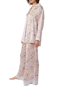 Make bedtime a bit more boho in flowery pajamas that live up to their dreamy designation. 28 1/2" to 31" top length; 28" inseam; 32" leg opening; 14" front rise; 17" back rise (size Medium) Top has spread collar; long sleeves 100% polyester Hand wash, line dry Imported Spring Matching Set Sleepwear, Floral Print Sleepwear For Pajama Party, Floral Print Sleepwear With Relaxed Fit Long Pants, Floral Print Relaxed Fit Pajamas, Floral Print Relaxed Fit Long Sleepwear Pants, Floral Print Sleepwear Long Pants For Loungewear, Floral Print Sleepwear With Relaxed Fit For Bedtime, Floral Print Relaxed Fit Sleepwear For Bedtime, Relaxed Fit Floral Print Sleepwear For Bedtime