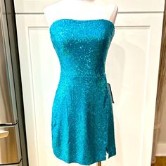 Nwt B. Darlin Blue Sequined Sweetheart Neckline Strapless Stretch Dress, Back Zip, Rubberized Strip Along Top Perimeter To Help Keep Top In Place, Flat Laid Measurements: Pit To Pit 16”, Waist 15”, Hips 18”, There Is Approximately 3” More For Stretch Allowance Fitted Light Blue Strapless Dress For Party, Blue Fitted Strapless Mini Dress, Blue Strapless Midi Dress With Fitted Bodice, Blue Fitted Bodice Mini Dress For Homecoming, Blue Fitted Strapless Maxi Dress, Blue Strapless Dress With Straight Neckline For Night Out, Blue Fitted Strapless Party Dress, Blue Fitted Strapless Dress For Party, Glamorous Blue Mini Dress With Fitted Bodice