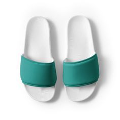 Women's teal slides A must-have for the summer: these women's slides. A pair of these will keep you comfy throughout your day of beach or pool activities, thanks to the cushioned upper strap and the textured footbed.  * Cushioned and durable faux leather upper strap * Lightweight polyurethane (PU) outsole * Contoured, textured footbed * Spot clean only * Printed, cut, and handmade * Blank product sourced from China Important: This product is available in the following countries: United States, C Green Non-slip Synthetic Slides, Comfortable Green Synthetic Flip Flops, Comfortable Green Slide Slippers, Comfortable Green Slides With Textured Footbed, Sporty Green Non-slip Slides, Green Comfortable Slippers With Textured Footbed, Green Slides With Textured Footbed, Green Casual Slides For Swimming, Comfortable Green Flip Flops