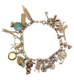 "Lady's vintage; yellow gold charm bracelet. This beautiful bracelet has a total of nineteen charms all stamped \"10K\". The bracelet weighs approximately 22.4 grams. It is in good condition and would make a beautiful addition to your vintage jewelry collection." Luxury Vintage Charm Bracelet, Luxury Gold Antique-style Charm Bracelet, Luxury Silver Charm Bracelet With Vintage Charm, Luxury Vintage Metal Charm Bracelet, Antique Bracelets With Dangling Charms For Gift, Antique Bracelets With Dangling Charms As Gift, Antique Style Bracelets With Dangling Charms As Gift, Vintage Gold Charm Bracelet With Dangling Charms, Vintage Gold Charm Bracelet Gift