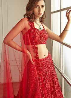 This gorgeous outfit is perfect for your wedding day! Features a ravishing red lehenga and bralette blouse with red sequins hand embroidered throughout the attire which looks glamorous and royal at the same time. The outfit is paired with red four sides sequins embroidered net dupatta. Composition : Blouse and Lehenga -Organza, Dupatta - Soft Net Care: Dry Clean Only and Vacuum Storage This product can be customised for sleeves, length of blouse and neckline Delivery : 6-8 weeks as the product is hand crafted. Check Size Guide or choose MySize for free customisation (All Sizes above XL can be made at 15% additional cost) For more information and sizes please contact fabiliciousfashion@gmail.com or visit our Copenhagen studio. Designer Red Sequined Sets, Red Embellished Saree For Reception, Red Embellished Floor-length Saree, Red Embellished Pre-draped Saree For Party, Embellished Red Pre-draped Saree For Festive Occasions, Red Sequined Dress With Traditional Drape, Red Wedding Saree With Intricate Embroidery, Red Wedding Pre-draped Saree With Intricate Embroidery, Designer Red Pre-draped Saree With Sequins