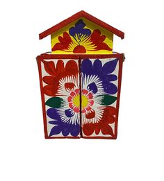 a birdhouse made out of paper with flowers painted on it