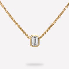 14KT Yellow Gold 1/4 CTW Diamond pendant with chain. The diamond emerald bezel slide pendant is a luxurious and striking piece of jewelry that perfectly balances timeless elegance with contemporary flair. The pendant features a bezel-set emerald cut diamond, and comes with a thin and elegant wheat chain. Its design allows the beauty of the emerald cut diamond to take center stage, while still adding a touch of contemporary flair and versatility. Material : 14KT Gold Pendant Dimension : 5.23x4.24 Emerald Cut Diamond, Bezel Set Diamond, Pendant With Chain, Diamond Chain, Emerald Stone, Emerald Cut Diamonds, Center Stage, 14kt Gold, Diamond Solitaire