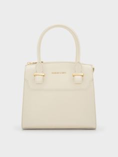 The Temmie structured tote bag is designed to take you from day to night. In soft cream, this bag is perfect for those who love a clean and structured white bag. It opens up to a spacious main compartment that features a back zip pocket and inner flap pocket that will help to keep your belongings organised. The gold-tone hardware adds luxurious shine and a sophisticated touch. It also comes with a detachable strap that let yo carry it in multiple ways. White Classic Box Bag For Shopping, Chic White Box Bag With Handle Drop, Everyday White Satchel With Handle Drop, Classic Daily Top Handle Satchel, Classic White Box Bag For Shopping, White Box Bag With Double Handle, Classic Top Handle Satchel For Daily Use, White Box Bag With Detachable Double Handle, White Satchel With Double Handle And Handle Drop