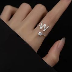 D I A M O N D ∙ I N I T I A L ∙ R I N G The most unique jewelry you can find, the perfect gift for you or your loved one. Introducing our exquisite Letter Initial Ring, a stunning blend of elegance and personalization that elevates your style to new heights. Crafted with the finest materials and attention to detail, this ring is a symbol of individuality W H Y ∙ Y O U 'L L ∙ L O V E ∙ I T• It's dainty and can be worn every day• A special piece you'll treasure for life• High-quality materials and Luxury Initials Engagement Rings, Luxury Diamond Ring With Initials For Gift, Silver Initial Ring With Diamond Accents For Wedding, Silver Wedding Initial Ring With Diamond Accents, Wedding Initial Ring In White Sterling Silver, Minimalist Diamond White Ring For Proposal, Trendy Silver Jewelry With Initials, Trendy Personalized Jewelry For Anniversary, Silver Initial Ring With Diamond Accents For Promise