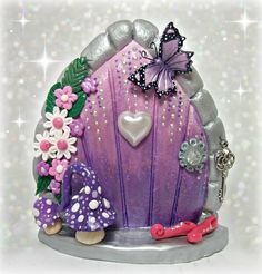 a purple fairy house with flowers and butterflies on it's roof, sitting in front of a sparkley background