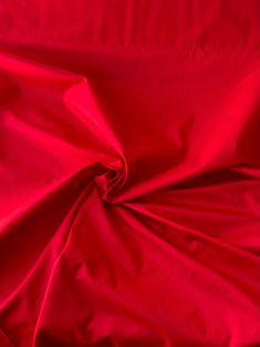 the red fabric is very soft and shiny