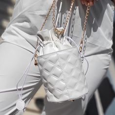 White Quilted Hand Bag With Detachable Gold Chain, Drawstring Closure, And Gold Feet Details. Size: 10" X 6" Approx. Brand: Unknown Price: $20 #Style #Fashion #Purse #Channices_chicboutique White Pouch Box Bag For Shopping, White Bucket Shoulder Bag With Mobile Phone Pocket, White Bucket Shoulder Bag With Phone Pocket, White Shoulder Bucket Bag With Mobile Phone Pocket, White Shoulder Bucket Bag With Phone Bag, White Shoulder Bag With Mobile Phone Pocket For Errands, Chic White Pouch Satchel, White Mobile Phone Bucket Shoulder Bag, White Bucket Box Bag With Adjustable Strap