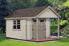 a small shed in the middle of a grassy area with trees and grass behind it