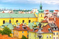 the city is full of colorful buildings and green roofs