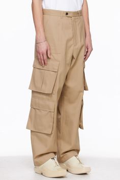 Polyester- and cotton-blend gabardine cargo pants. · Paneled construction · Belt loops · Four-pocket styling · Zip-fly · Bellows pockets at outseams · Horn hardware Supplier color: Beige Baggy Cargo Jeans For Work, Beige Cotton Cargo Pants With Multiple Pockets, Workwear Cargo Pants With Multiple Pockets, Beige Utility Parachute Pants With Belt Loops, Khaki Parachute Pants With Multiple Pockets For Work, Beige Wide Leg Cargo Pants With Cargo Pockets, Baggy Full-length Cargo Pants With Patch Pockets, Khaki Parachute Pants With Cargo Pockets, Khaki Work Pants With Multiple Pockets