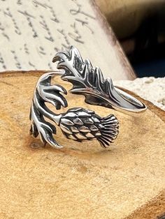 Beautifully detailed thistle ring sure to make a statement! ✦Sterling silver adjustable ring.  **PLEASE NOTE: THIS LISTING IS ONLY FOR ONE RING. ** UNLESS CHOOSEN AS A SET** **Add only earrings available with the link below.** https://daintyshack.etsy.com/listing/1788457645/thistle-earrings-scottish-thistle As with all adjustable rings we recommend adjusting this ring to the correct size and then leaving it alone. Excessive opening and closing can weaken the band and create cracks and possible b Lotus Flower Engagement Ring, Thistle Jewellery, Thistle Earrings, Thistle Ring, Scottish Thistle, Flower Engagement Ring, Symbolic Jewelry, One Ring, Nature Jewelry