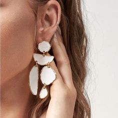 White Dangle Drop Earrings Trendy White Metal Earrings, Modern White Dangle Linear Earrings, Chic White Chandelier Earrings Gift, Trendy White Drop Earrings, Chic White Metal Earrings, Trendy Single White Earring, Trendy White Single Earring, Elegant White Metal Chandelier Earrings, Modern Single White Earring