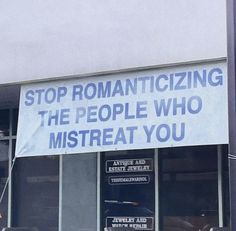 a sign that says stop romanticizing the people who mistreat you on it