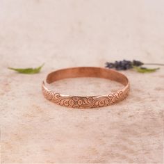 Introducing our Hand carved Copper Bracelets, exquisitely crafted with love in Nepal by skilled artisans who have transformed our vision into a reality. Elevate your style with these timeless accessories that effortlessly blend the essence of hippie and boho aesthetics, meticulously created for the free-spirited souls. PRODUCT DETAILS: - Handcrafted in Nepal - Made from Pure Solid Copper - Unisex design, perfect for all - Free size and Adjustable, ensuring a comfortable fit for everyone ARTHRITI Handmade Bohemian Bracelets For Anniversary, Spiritual Copper Bangle As Gift, Adjustable Bohemian Bangle For Anniversary, Spiritual Cuff Bracelet With Intricate Design As Gift, Spiritual Copper Bangle, Spiritual Cuff Bracelet With Intricate Design For Gift, Spiritual Copper Bangle Bracelets, Nature-inspired Cuff Bangle Bracelet As Gift, Spiritual Copper Bangle Jewelry