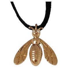 18 Karat Yellow Gold Bee Pendant Necklace with diamonds, Tiffany designer , Thomas Kurilla created this years ago, but this is the new updated bee made exclusively for 1stdibs. Bees, It credible little creatures. Hard workers. Great community spirit. Who doesn't like honey? A miracle food. This bee is 11/16ths high x 5/8 inch wide. or 18 mm x 17 mm. 1.1 mm with diamond eyes , 1.1mm set in 18 karat yellow gold. The cord is ultra suede 32 inches long. Earrings to match coming soon. Stamped 18k. Ma Bee Pendant, Gold Bee, Diamond Eyes, Diamond Pendant Necklace, Gia Diamond, Diamond Pendant, Necklace Lengths, Bee, Handmade Items