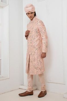 Pink raw silk sherwani with floral embroidery all over. Paired with a kurta and churidar. - Aza Fashions Designer Wear Sherwani With Dabka For Spring, Designer Dabka Sherwani For Spring, Bollywood Sherwani With Zari Work For Spring, Spring Designer Wear Sherwani With Dabka, Bollywood Style Dabka Sherwani For Spring, Bollywood Dabka Sherwani For Spring, Spring Fitted Dabka Sherwani, Traditional Sherwani With Pallu For Spring, Traditional Sherwani With Traditional Drape For Spring