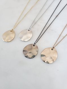 "Simple Geometric Wave Plate Pendant Long Necklace Chain Length: 24″ + 2\" Adjustable Extension. Total 26\" Clasp: Yes Type of Clasp: Lobster Claw Pendant Length: 7/8\" Pendant Width: 3/4\" Weight: 6g Metal: Rhodium or gold plated chain, brush metal pendant, tarnish resistant Options: Silver Gold  Gunmetal Champagne" Everyday Silver Brass Chain Necklace, Everyday Metal Jewelry With Large Pendant, Silver Brass Charm Necklace With Adjustable Chain, Minimalist Silver Brass Charm Necklaces, Nickel-free Minimalist Metal Necklaces, Modern Hammered Necklaces As Gift, Silver Brass Necklace With Adjustable Chain, Nickel-free Teardrop Pendant Necklace For Everyday, Nickel-free Metal Necklaces For Everyday