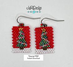 a pair of earrings made out of legos with a christmas tree on the front