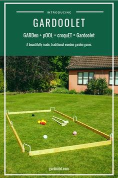 an outdoor game set up in the grass with balls and tees on it, next to a house