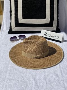 Our Palm Desert Panama fit in perfectly on our latest road trip photo shoot. Stunning, classic, chic - everything you've ever wanted in a hat. Featuring a molded crown with a pinched 10cm brim and hand woven straw, it's crystallized on the tone on tone ribbon with a simple Swarovski rivet. - 4" brim - Adjustable inner drawstring for custom sizing Classic Brown Hat Bands For Summer, Chic Short Brim Panama Hat For Beach Season, Chic Vacation Hats In Toquilla Straw, Chic Panama Fedora For Beach Season, Chic Straw Hat For Vacation, Summer Travel Straw Hat With Short Brim, Chic Natural Straw Hat For Vacation, Summer Travel Straw Boater Hat, Chic Straw Hat With Short Brim For Vacation