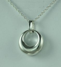 This beautiful cremation locket is a unique way to hold a loved one close. This pendant can hold a small amount of cremains, lock of hair, or dirt from the sacred burial grounds. This piece comes on an 18" matching chain and 1/2 inch in size. GOOD TO KNOW: ♥ Available in Sterling Silver ♥THIS PENDANT CAN BE ENGRAVED-SEE PERSONALIZATION SECTION ♥Fill kit included with pendant CARE: ♥Sterling Silver is resistant to rust, corrosion, and tarnishing, but we still recommend for the longevity of the pe Classic Crescent Jewelry As A Gift, Classic Crescent Jewelry For Gifts, Classic Crescent Jewelry For Gift, Classic Crescent Jewelry Gift, Classic Crescent-shaped Gift Jewelry, Nickel-free Oval Pendant Necklace For Anniversary, Elegant Teardrop Pendant Necklace For Memorial, Elegant Memorial Jewelry Teardrop Pendant, Elegant Teardrop Jewelry For Memorial