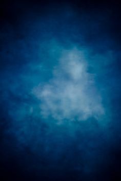 an airplane flying through the blue sky with clouds in the foreground and below it