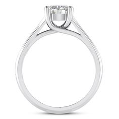 a white gold ring with a single stone in the center