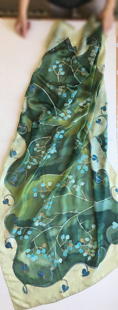 Green Silk Scarf hand painted. Mothers Day gift. Woman fashion wrap in green and aqua colours combo. Handpainted scarves. Art Deco shawl painted. Long Luxurious shawls. Unique handmade scarves. Silk painting, Evening shawl wrap. Garden Wedding accessory. Wedding accessory. Romantic wedding style. Botanical scarf. Olive green silk scarf with turquoise flowers painted in stylized composition. ♥This is a unique, hand painted silk scarf measuring 35 by 70 inches. Silk scarf painted on pure silk 6mm, Green Bohemian Shawl Dupatta, Handmade Bohemian Green Silk Scarf, Handmade Green Bohemian Silk Scarf, Green Bohemian Silk Shawl, Green Bohemian Dupatta Scarf, Hand Painted Green Silk Scarf, Green Bohemian Silk Scarf For Gift, Green Bohemian Silk Scarf As Gift, Green Silk Bohemian Scarves