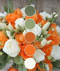 an orange and white bridal bouquet with greenery, tulips and roses