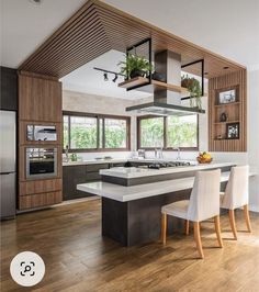 a kitchen with an island, stove and cabinets in it's center area is shown