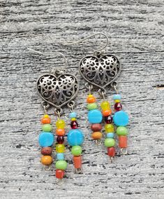 Southwestern Silver Heart Earrings Colorful Cowgirl Earrings Handmade Rainbow Filigree Earrings Arizona Rustic New Mexico Tribal Indian Bohemian Heart Beads Jewelry For Festivals, Southwestern Dangle Beaded Earrings As Gift, Nickel Free Beaded Earrings For Festival, Nickel Free Round Beads Earrings For Festival, Bohemian Style Heart Earrings As A Gift, Colorful Beaded Sterling Silver Earrings As Gift, Beaded Dangle Heart Earrings For Gift, Colorful Beaded Earrings In Sterling Silver, Silver Beaded Earrings With Colorful Beads For Festival