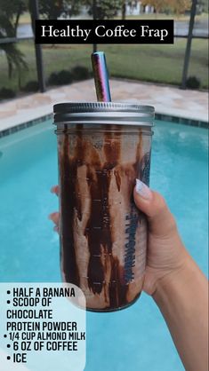 a person holding up a drink in front of a pool with text overlay that reads healthy coffee frap