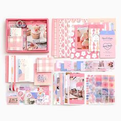 the contents of a pink and white scrapbook spread out on top of each other