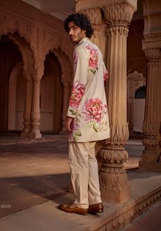 Ace the ethnic Indian look in a stylish contemporary twist with multicolour floral design long jacket style sherwani with tonal thread embroidery. The long jacket is styled with a coordinated tonal colour straight pants Long Jacket Style, Genshin Redesign, Men Poses, Indian Jackets, Indian Look, Indian Wedding Reception, Thread Embroidery, Outdoor Men, School Fits