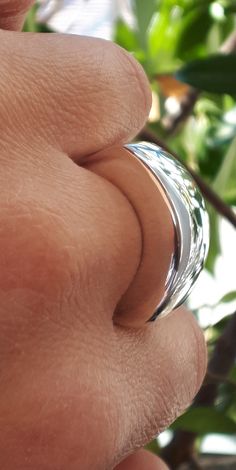 "Statement Dome Ring, Sterling Silver, Minimalist Ring, Designer Unique Style Ring, Wide Domed Ring, Chunky Dome Ring, Wide Band Ring Modern and Chic in Design, this Statement Dome Ring is stunning. Perfect on it's own and just may be the only ring you need. Handmade Sterling Silver Ring with polished finish ✔~ 100% Handmade ~ ✔~ 100% 925 Sterling Silver ~ ✔~ Height 6.3 MM ~ \"the upper part\" ~ ✔~ Width 11.0 MM ~ \"the upper part\" ~ ✔~ Length 25.0 MM ~ \"the upper part\" ~ ✔~ Weight 15.0 grams Adjustable Polished Dome Ring For Promise, Adjustable Polished Dome Ring For Promises, Sterling Silver Stackable Dome Ring, Stackable Sterling Silver Dome Ring, Silver Rings With Shiny Finish For Everyday, Shiny Finish Round Band Rings For Gift, Stackable White Gold Dome Ring As Gift, Round Band Rings With Shiny Finish For Gift, Stackable White Gold Dome Ring