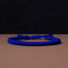 "◾ The handmade navy blue Tibetan bracelet for luck and protection is a beautifully crafted accessory, each knot is meticulously tied whos creates an amazing pattern. ✅ Adjustable bracelet - the slip knot lets you adjust the size. ➰ Sizes: S - Fully Closed - 5.9\"inches (15cm) / Full Opened - 9.8\"inches (25cm) M - Fully Closed - 6.6\"inches (17cm) / Full Opened - 10.6\"inches (27cm) L - Fully Closed - 7.4\"inches (19cm) / Full Opened - 11.4\"inches (29cm) 🟦 The color of the bracelet is navy blue. ◽ More colors and models are available in the shop. ◽ Just check out the shop. ✔️ Please note that due to the difference between different monitors, the image may not reflect the actual color of the item. ✍ If you have any questions please contact me." Adjustable Blue Spiritual Braided Bracelet, Blue Spiritual Bracelet With Sliding Knot, Blue Spiritual Bracelets With Sliding Knot, Blue Spiritual Friendship Bracelets With Sliding Knot, Blue Spiritual Friendship Bracelet With Sliding Knot, Resizable Nylon Cord Braided Bracelets, Blue Resizable Spiritual Friendship Bracelets, Resizable Blue Spiritual Friendship Bracelet, Spiritual Handmade Blue Braided Bracelets