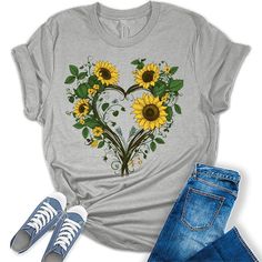 Style: Add some sunshine to your wardrobe with our stylish flower shirts for women! These graphic tees for women are the perfect blend of style and comfort and are sure to add some fun and fashion to your attire. Quality: Our nature lover tops for women are designed and printed with love in the USA. We use high-quality inks on our premium Bella Canvas unisex sunflower tshirt for a bold and stylish look. Fabric: Our womens tops are crafted with a premium blend of 100% Airlume combed and ring-spun cotton, this Bella Canvas unisex t-shirt is incredibly soft, lightweight, and breathable. Perfect Fit: Our womens summer tops come in a variety of sizes, such as sunflower shirts for women plus size, so you can find the perfect fit! We have sizes from XS - 4XL so everyone in the family can join in Casual Sublimation Print T-shirt For Mother's Day, Mother's Day Printed Graphic Tee, Casual T-shirt With Sublimation Print For Mother's Day, Custom Print Short Sleeve Sublimation Design For Spring, Spring Gray Shirt With Graphic Print, Sunflower Tshirt, Ladies T Shirt Design, Graphic Tees For Women, Sunflower Shirt