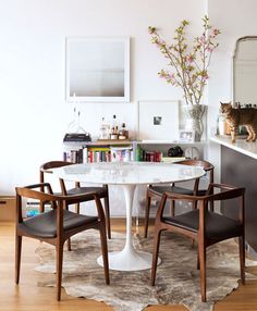 a dining room table with chairs around it