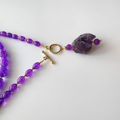 < Long glass beaded necklace with amethyst stone pendant > Very original and elegant combination. The stone is natural amethyst. Amethyst is the stone of St. Valentine and faithful love. It carries the energy of fire and passion, creativity and spirituality. This necklace can be beautiful accent to any look! > Necklace length - 89 cm (35 in) > Necklace weigth - 78 gm Purple Amethyst Faceted Bead Crystal Necklaces, Purple Amethyst Crystal Necklaces With Faceted Beads, Lavender Crystal Necklaces With Faceted Beads For Gifts, Amethyst Crystal Necklace With Faceted Beads As Gift, Lavender Faceted Beads Crystal Necklace Gift, Purple Faceted Beads Necklace As Gift, Purple Amethyst Crystal Necklace With Faceted Beads, Purple Beaded Necklaces With Faceted Beads As Gift, Purple Faceted Beads Necklace For Gift