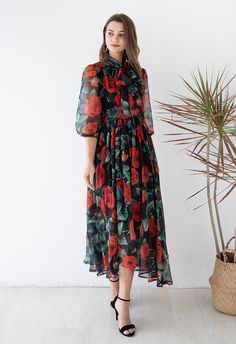 You'll exude a feeling of a mysterious feminine vibe when wearing this black base maxi dress. Features a black base to accentuate those red roses print, adding the design of the self-tie ribbon at the front, it's mature and cute, it should be your wardrobe essential.    - Roses Print  - Chiffon fabric finished  - Self-tie ribbon at front  - Shirred elastic waist  - Elastic cuffs  - Asymmetric hem  - Concealed back zip closure  - Lined  - 100% Polyester  - Hand wash cold            Size  Length  Bust  Waist  Shoulder  Sleeves      XS-S  cm  123-132  88  60-80  37  45      inch  48.5-52  34.5  23.5-31.5  14.5  17.5      M-L  cm  124-133  92  64-84  39  46      inch  48.8-52.5  36  25-33  15  18      XL-XXL  cm  125-134  96  68-88  41  47      inch  49-52.5  37.5  26.5-34.5  16  18.5 Tie Ribbon, Roses Print, Led Dress, Fashion Buyer, Chiffon Maxi, Chiffon Maxi Dress, Indie Design, Print Chiffon, Mecca